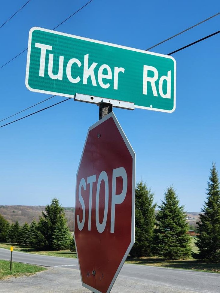 This image has an empty alt attribute; its file name is Tucker-Road-sign-compressed-4-23-e1682012240156.jpg
